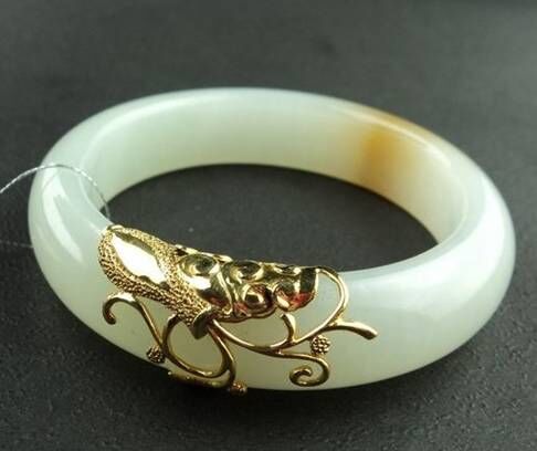 和田玉手镯有裂戴着能消失吗,和田玉的矿点戴时间长了能消失吗