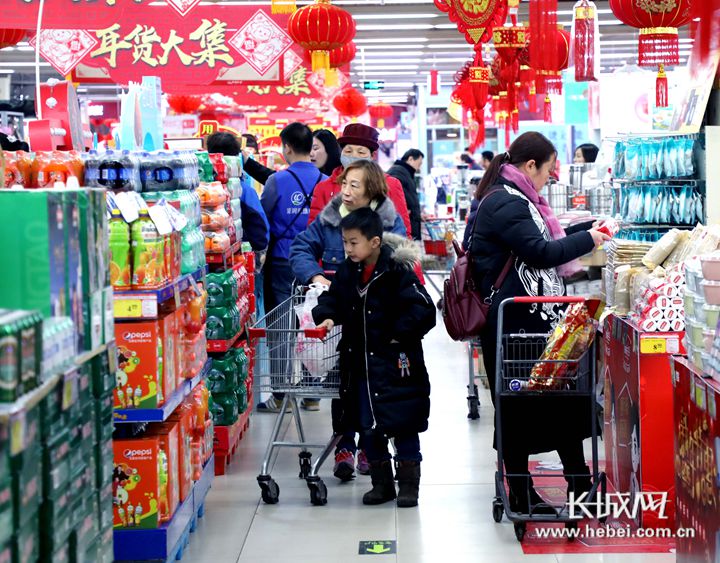 年货消费今年更红火,年货市场红火图片大全